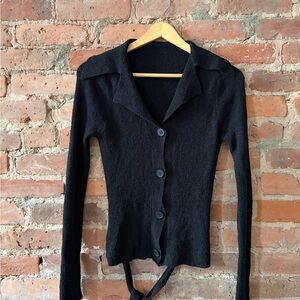 Soft knit cropped cardigan with open tie back in black